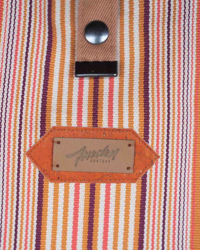 logo Ineden couture sur fond liège orange et toile rayée orange 